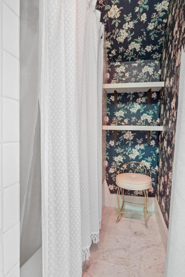 bathroom with wallpapered walls