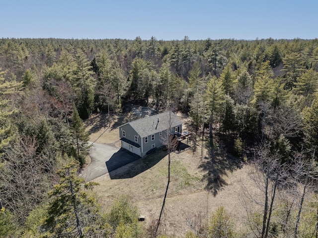 bird's eye view featuring a wooded view