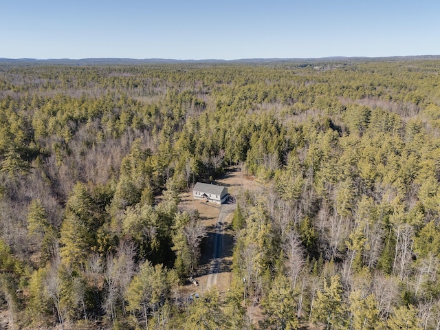 bird's eye view featuring a wooded view