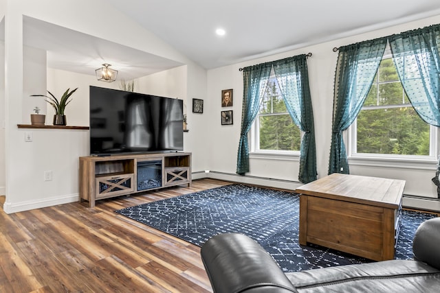 living room featuring a baseboard radiator, lofted ceiling, wood finished floors, and baseboards