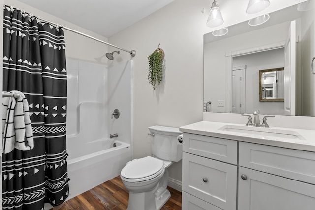 full bathroom with toilet, vanity, wood finished floors, and shower / bath combo with shower curtain