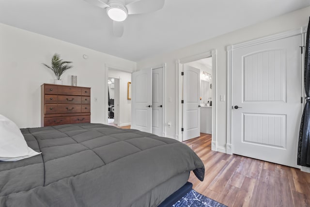 bedroom featuring a ceiling fan and wood finished floors