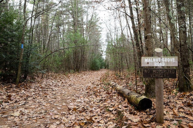 view of street featuring a forest view