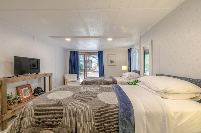 bedroom with wooden ceiling and access to exterior