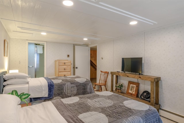 bedroom featuring a baseboard heating unit, wallpapered walls, and recessed lighting
