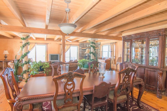 54 Folsom Ridge Rd, Burlington, ME 04417 - dining room with beam ceiling and hardwood / wood-style flooring
