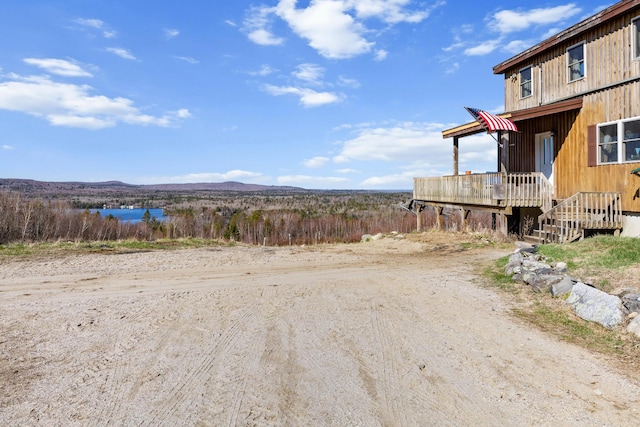 54 Folsom Ridge Rd, Burlington, ME 04417 - view of yard with a deck with water view
