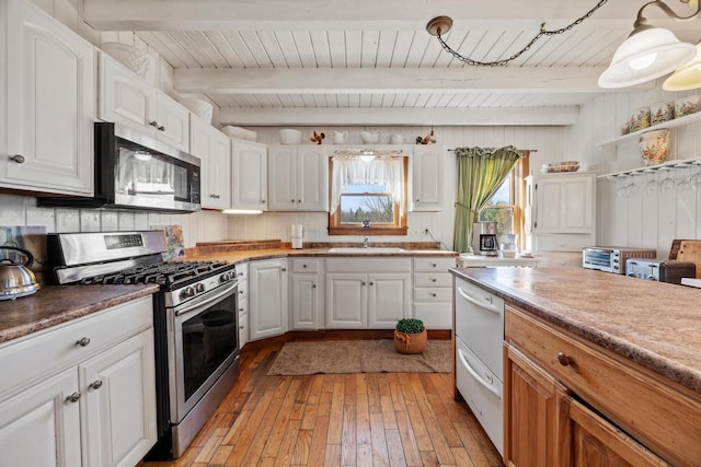 54 Folsom Ridge Rd, Burlington, ME 04417 - kitchen featuring white cabinetry, stainless steel appliances, light wood-style flooring, and a sink