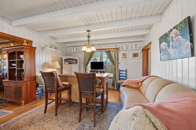 54 Folsom Ridge Rd, Burlington, ME 04417 - dining area featuring wood walls, a notable chandelier, and wood-type flooring