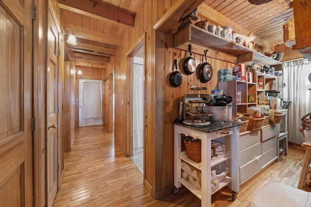 54 Folsom Ridge Rd, Burlington, ME 04417 - hall with wooden walls, wooden ceiling, beam ceiling, and light wood-style floors