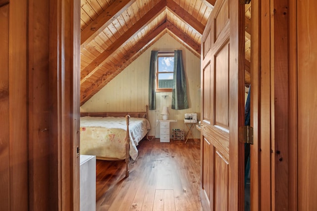 54 Folsom Ridge Rd, Burlington, ME 04417 - unfurnished bedroom with vaulted ceiling, hardwood / wood-style flooring, wood walls, and wood ceiling