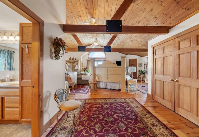 54 Folsom Ridge Rd, Burlington, ME 04417 - bedroom featuring vaulted ceiling with beams, ornate columns, light wood-style floors, and wood ceiling