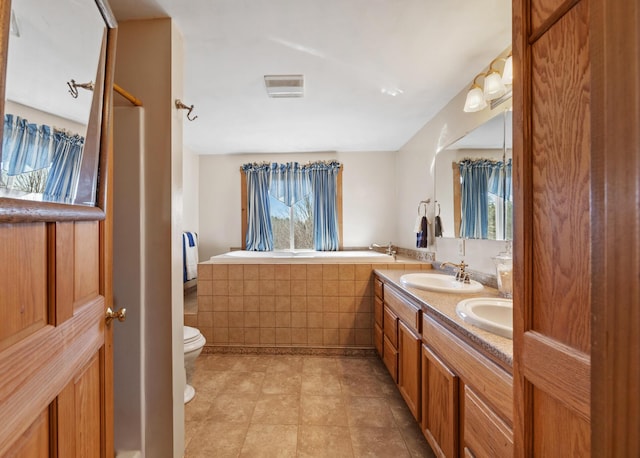 54 Folsom Ridge Rd, Burlington, ME 04417 - full bath with a sink, toilet, double vanity, visible vents, and tile patterned flooring