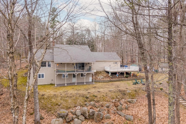 31 Pulpit Rock Rd, Raymond, ME 04071 - rear view of property featuring roof with shingles and a deck