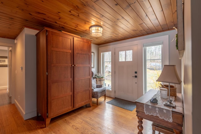 31 Pulpit Rock Rd, Raymond, ME 04071 - foyer featuring wood ceiling, healthy amount of natural light, light wood finished floors, and baseboards