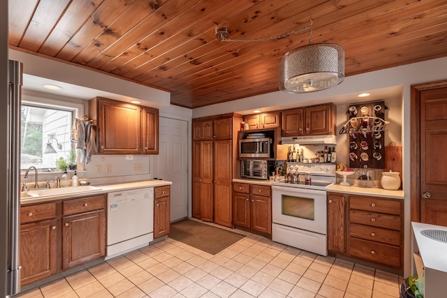 31 Pulpit Rock Rd, Raymond, ME 04071 - kitchen with white appliances, a sink, under cabinet range hood, brown cabinetry, and wooden ceiling