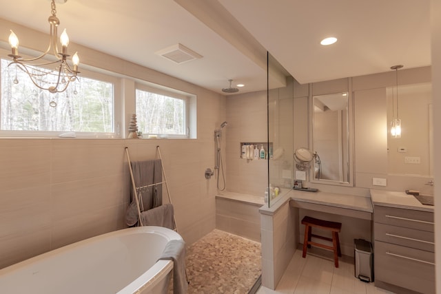 31 Pulpit Rock Rd, Raymond, ME 04071 - full bath featuring a bath, a walk in shower, tile patterned floors, and recessed lighting