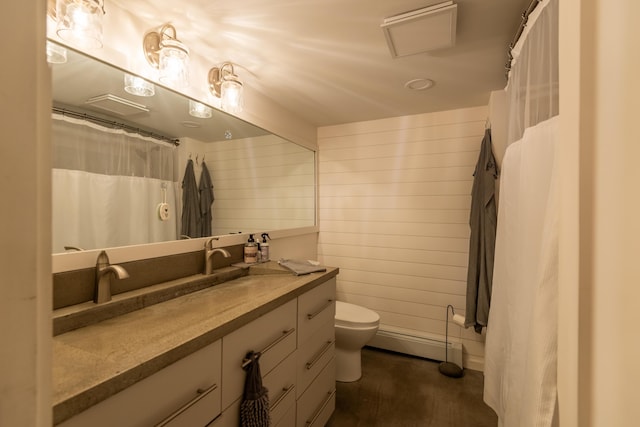 31 Pulpit Rock Rd, Raymond, ME 04071 - full bathroom with a baseboard heating unit, toilet, and vanity