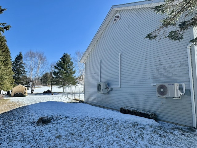 view of snowy exterior featuring ac unit