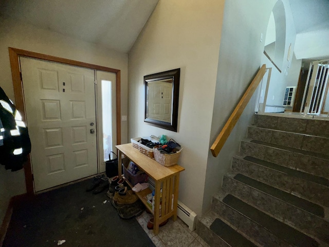 entryway featuring lofted ceiling, stairs, and a baseboard radiator