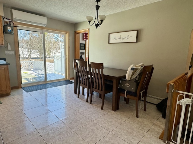 dining space with a wall mounted air conditioner, a textured ceiling, and light tile patterned floors