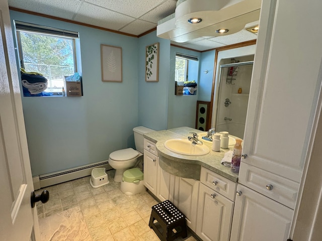 bathroom with a shower stall, a baseboard heating unit, vanity, baseboards, and toilet