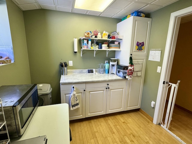 interior space with light wood-style flooring and baseboards