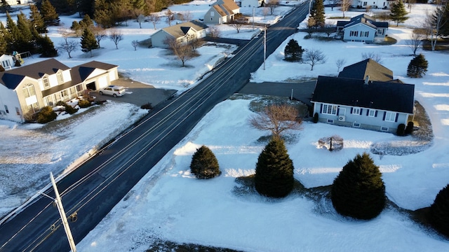 snowy aerial view featuring a residential view