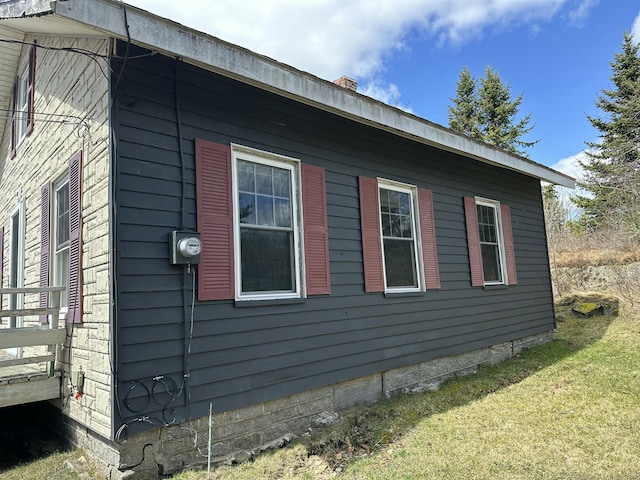 18 View St, Jonesport, ME 04649 - view of side of home with a lawn and a chimney