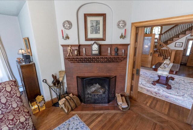 36 Cutler Rd, East Machias, ME 04630 - living room with parquet floors, stairs, and a fireplace