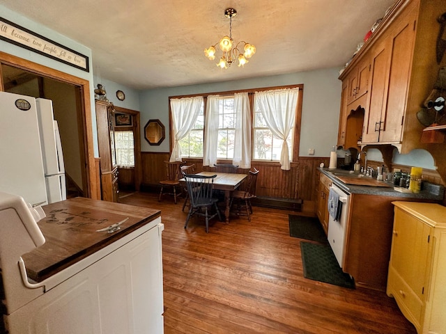 36 Cutler Rd, East Machias, ME 04630 - kitchen with white appliances, dark countertops, wainscoting, wood finished floors, and a sink