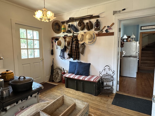36 Cutler Rd, East Machias, ME 04630 - mudroom featuring hardwood / wood-style floors, a chandelier, and ornamental molding