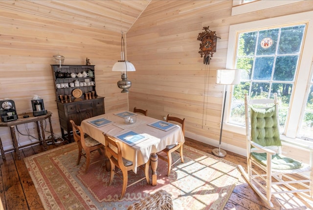 36 Cutler Rd, East Machias, ME 04630 - dining space featuring wooden walls, vaulted ceiling, and hardwood / wood-style flooring