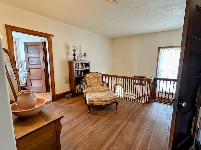 36 Cutler Rd, East Machias, ME 04630 - sitting room with hardwood / wood-style flooring, baseboards, and an upstairs landing