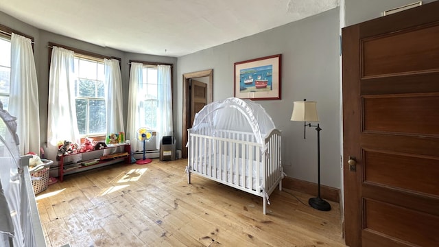 36 Cutler Rd, East Machias, ME 04630 - bedroom featuring baseboard heating, light wood-style floors, and baseboards