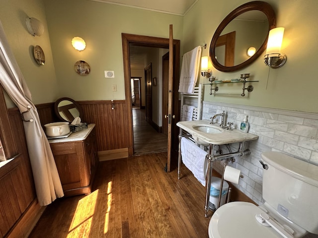 36 Cutler Rd, East Machias, ME 04630 - bathroom with a wainscoted wall, wood finished floors, and toilet