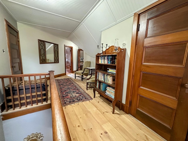 36 Cutler Rd, East Machias, ME 04630 - sitting room with light wood finished floors, lofted ceiling, and an upstairs landing