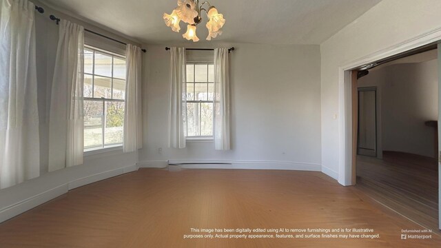 36 Cutler Rd, East Machias, ME 04630 - unfurnished room featuring wood finished floors, a chandelier, and baseboards