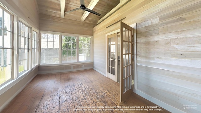 36 Cutler Rd, East Machias, ME 04630 - unfurnished sunroom featuring french doors, baseboards, lofted ceiling, wood walls, and healthy amount of natural light