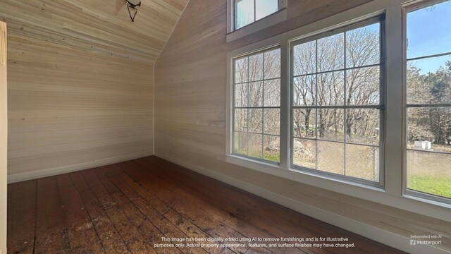 36 Cutler Rd, East Machias, ME 04630 - unfurnished room with healthy amount of natural light, vaulted ceiling, dark wood finished floors, and wood walls