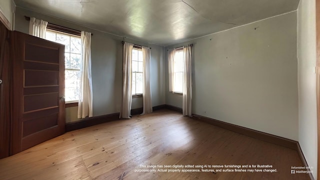 36 Cutler Rd, East Machias, ME 04630 - empty room with light wood finished floors, plenty of natural light, and baseboards