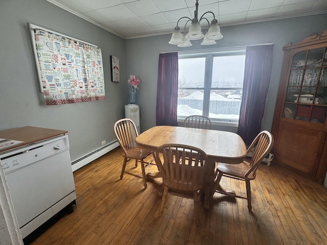 dining area with a baseboard radiator, crown molding, a chandelier, and hardwood / wood-style floors