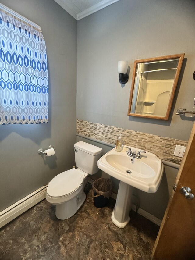 bathroom with a baseboard radiator, toilet, and ornamental molding