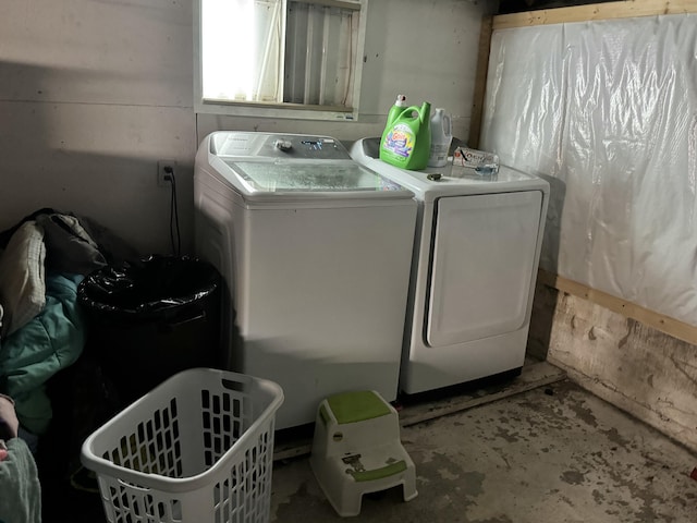 washroom featuring laundry area and separate washer and dryer