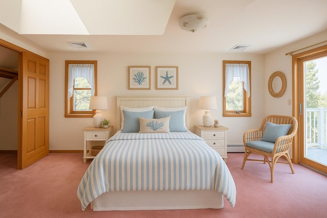 bedroom featuring baseboard heating, access to exterior, visible vents, and carpet