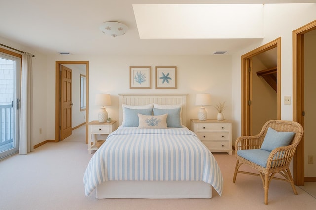 bedroom with baseboards, visible vents, and light colored carpet