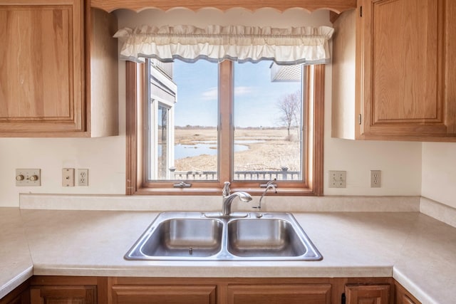 kitchen with light countertops and a sink