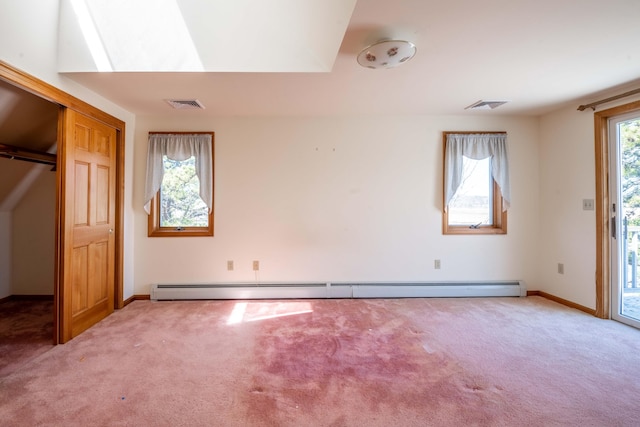 unfurnished bedroom featuring a baseboard radiator, carpet, access to exterior, and visible vents