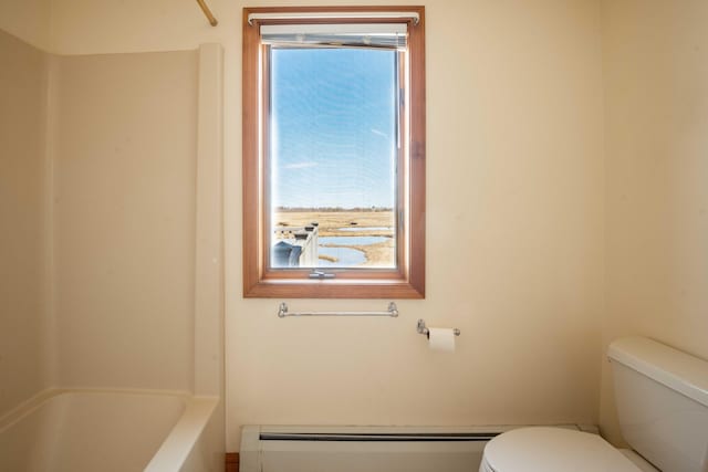 full bath featuring a baseboard heating unit and toilet