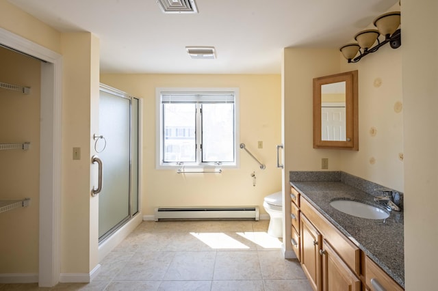 full bathroom featuring a baseboard radiator, vanity, visible vents, and a stall shower